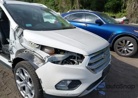 2017 Ford Escape Titanium z USA, uszkodzony, nr VIN 1FMCU9JD3HUD80510